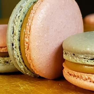 pale pink and green colored macarons